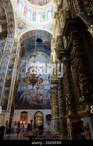 Sunlight streams through the domed roof of the church of Saints Anthony and Theodosius lighting the exquisite paintings which adorn the walls. Stock Photo