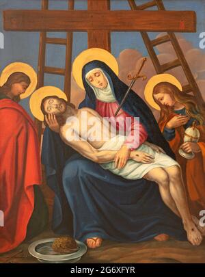 VIENNA, AUSTIRA - JUNI 17, 2021: The painting  Deposition of the cross (Pieta) as part of Cross way stations in church Rochuskirche by unknown artist. Stock Photo