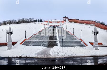 Kremlin is a fortress in the historic city center of Nizhny Novgorod, Chkalov ladder (also Volzhskaya staircase) staircase in Russia. Winter. Stock Photo