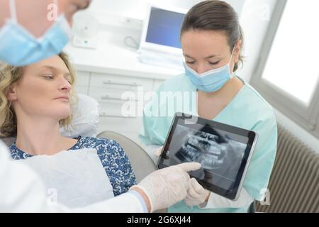 dentist and patient choosing treatment in a consultation Stock Photo