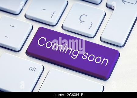 Coming soon phrase on computer Keyboard Key Stock Photo