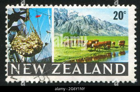 NEW ZEALAND - CIRCA 1968: stamp printed by New Zealand, shows cargo hoist, grazing cattle,  circa 1968 Stock Photo