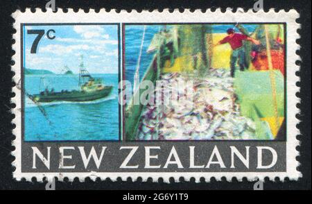 NEW ZEALAND - CIRCA 1968: stamp printed by New Zealand, shows trawler, catch, circa 1968 Stock Photo