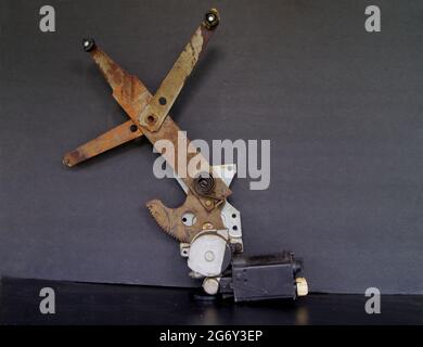 An Old Power Window Motor and Regulator Stock Photo