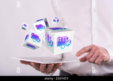 Document management concept above a tablet held by a man in background Stock Photo