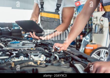 Modern Car engine, before and after cleaning maintenance, half divided