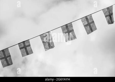 Black and white photo of England bunting against on a cloudy sky Stock Photo