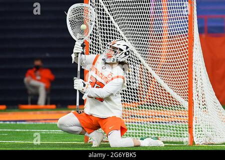 Syracuse, New York, USA. 06th Mar, 2021. Syracuse Orange goalie Drake Porter (33) makes a save against the Vermont Catamounts during the first half of an NCAA mens lacrosse game on Saturday, March 6, 2021 at the Carrier Dome in Syracuse, New York. Syracuse won 17-13. Rich Barnes/CSM/Alamy Live News Stock Photo