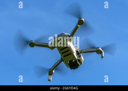 DJI Mavic Mini drone flying Stock Photo