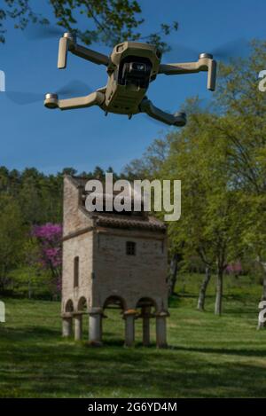 DJI Mavic Mini drone flying over a pigeonnier at Chateau Saurs, in southern France. Stock Photo