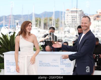 (210709) -- CANNES, July 9, 2021 (Xinhua) -- Danish director Joachim Trier (R) and Norwegian actress Renate Reinsve pose during a photocall for the film 'Verdens Verste Menneske' (The Worst Person In The World) at the 74th edition of the Cannes Film Festival in Cannes, southern France, on July 9, 2021. 'The Worst Person In The World' will compete for the Palme d'Or during the 74th Cannes International Film Festival which is held from July 6 to 17, 2021. (Xinhua/Gao Jing) Stock Photo