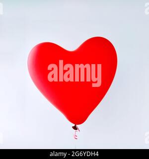 Red heart balloon template on white background. Abstract love symbol. Happy Valentine's day. Celebrate party or birthday template Stock Photo