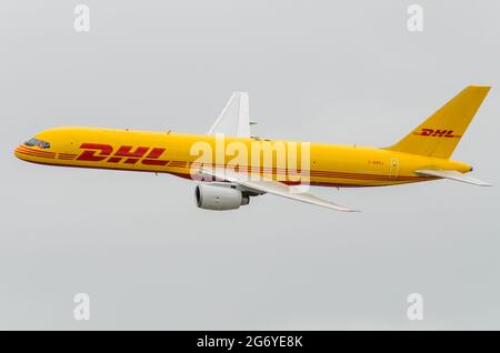 DHL Air Boeing 757 G-BMRJ cargo transport jet plane flying at an airshow. Boeing 757-200 freight airplane. Deutsche Post, EAT Leipzig operated airline Stock Photo