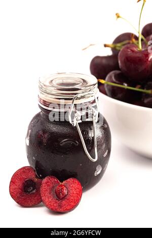 A Jar of Homemdae Cherry Jam Isolated on a White Background Stock Photo