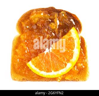 A Single Piece of Wheat Bread Toasted with Orange Marmalade Isolated on a White Background Stock Photo