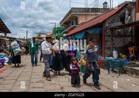 San Juan Chamula, Mexico - May 11, 2014: A family in a street market in the town of San Juan Chamula, in Chiapas, Mexico. Stock Photo