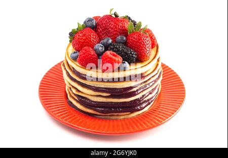 Stack of Berry Pancakes with Compote Spread Isolated on a White Background Stock Photo