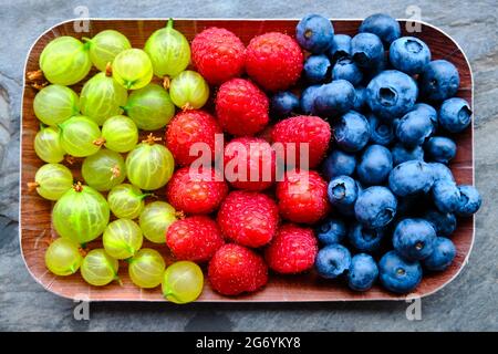 Mix of fruits on slate background Stock Photo
