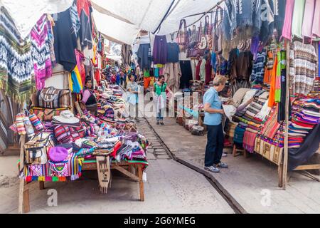 PISAC, PERU - MAY 22, 2015: Famous indigenous market in Pisac, Sacred Valley of Incas, Peru. Stock Photo