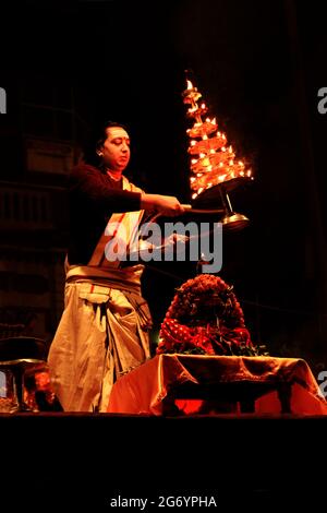 Varanasi, India 01 February 2021 Ganga aarti ceremony rituals performed by Hindu priests at Dashashwamedh Ghat in Varanasi Uttar Pradesh India Stock Photo