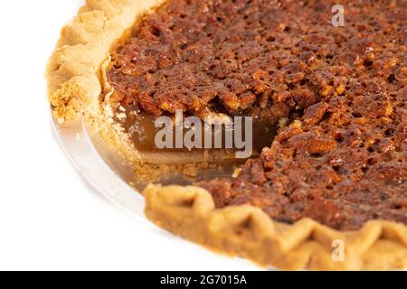 Traditional Pecan PIe with a Slice Cut Out Isolated on a White Background Stock Photo