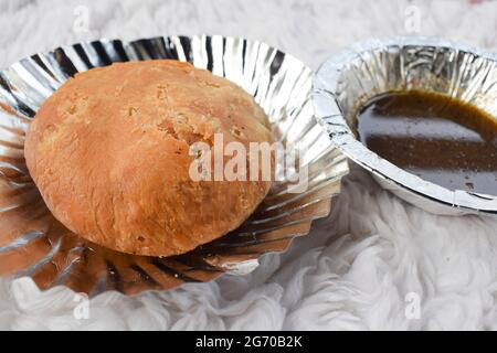 Delicious popular Indian teatime snack or breakfast dish item Dal Kachori deep fried. top view Kachodi snacks serve with khajur chutney Stock Photo