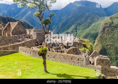 MACHU PICCHU, PERU - MAY 18, 2015: Crowds of visitors at Machu Picchu ruins, Peru. Stock Photo