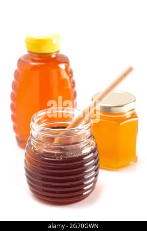 Jars of Raw Natural Honey Isolated on a White Background Stock Photo