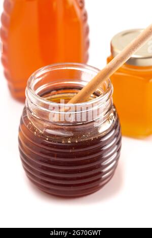 Jars of Raw Natural Honey Isolated on a White Background Stock Photo
