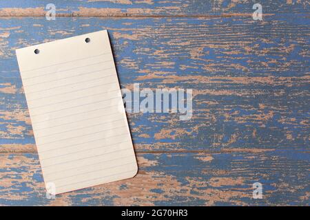 A Piece of Antique Paper on a Rustic Wood Background Perfect for Slides or Presentations Stock Photo