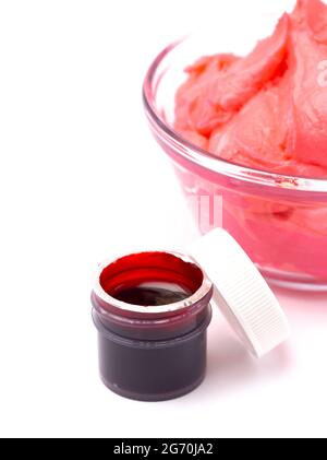 An Opened Pot of Red Gel Food Coloring for Baking Isolated on a White Background Stock Photo