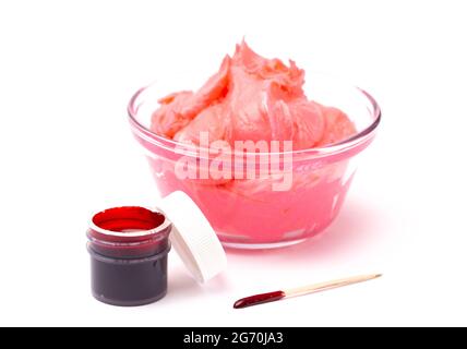 An Opened Pot of Red Gel Food Coloring for Baking Isolated on a White Background Stock Photo