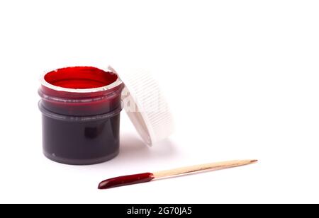 An Opened Pot of Red Gel Food Coloring for Baking Isolated on a White Background Stock Photo