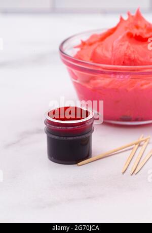 Opened Pot of Gel Food Coloring on a Marble Counter Top Stock Photo