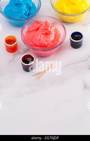 Opened Pot of Gel Food Coloring on a Marble Counter Top Stock Photo