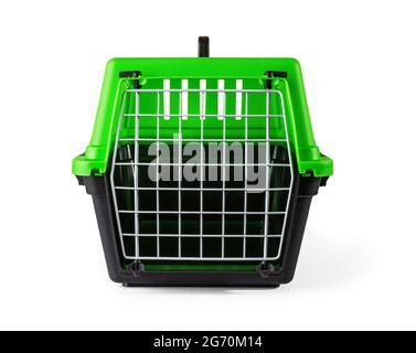 Cat carrier with locked door isolated on white background. Transportation of animals to the veterinary clinic. Empty plastic travel box with handle. Stock Photo