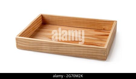 Simple rectangular serving tray isolated on white. Rustic eco-friendly tableware of natural wood. Empty dishes for food design. Vintage retro style. Stock Photo
