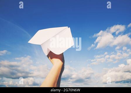 paper plane in hand ready to fly Stock Photo