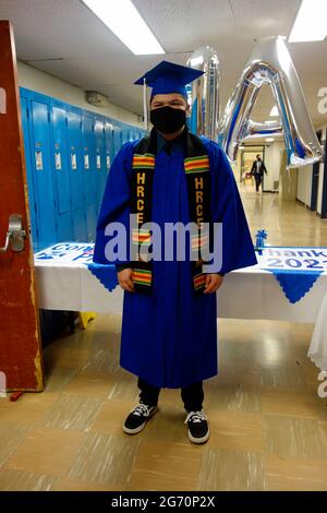 High school graduation during a covid-19 pandemic wearing a mask Stock Photo
