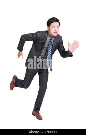 Young handsome businessman staring ahead and running.Isolated on white background. Stock Photo