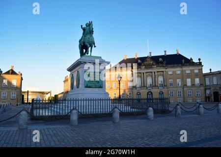 Copenhagen, Denmark - July 2021: Monumental equestrian statue of Amalienborg's founder, King Frederick V, in the central square of Amalienborg Stock Photo