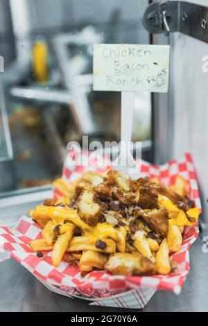 Delicious Chicken and Bacon with Ranch Cheese Fries. Stock Photo