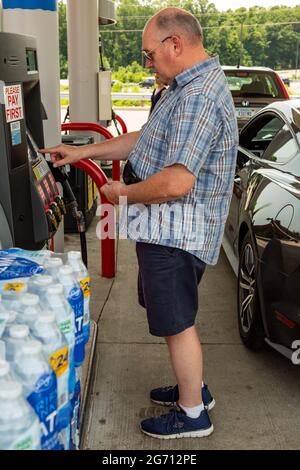 A man makes his selection at the fuel pump of a Kroger gas station in Fort Wayne, Indiana, USA. Stock Photo