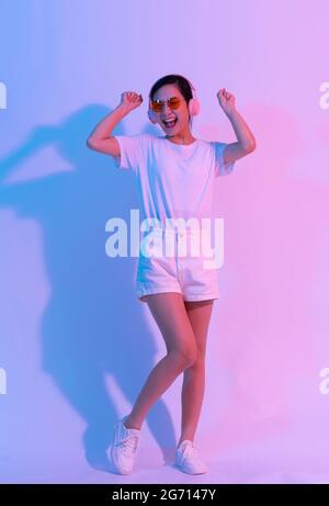 Young Asian woman doing exercise on white background Stock Photo