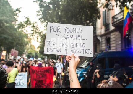 Barcelona, Spain. 09th July, 2021. A protester holds up a placard that says, 'for Younes and Samuel for those who are not and us' during the protest.Protesters take to the streets of Barcelona against LGTBI phobia and the death of Samuel Luiz, a 24-year-old homosexual young man murdered in a homophobic attack last week in the city of A Coruña, Spain. (Photo by Thiago Prudencio/SOPA Images/Sipa USA) Credit: Sipa USA/Alamy Live News Stock Photo