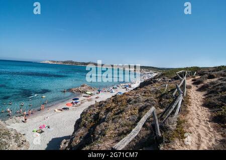 Blissful lagoon seascape seen through coastal rocks in Rena Majore