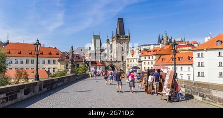 Tourists at souvenir stalls on the Charles bridge in Prague, Czech Republic Stock Photo