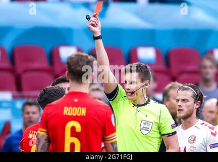 File photo dated 26-06-2021 of Wales' Harry Wilson (hidden) is sent off for a foul on Denmark's Joakim Maehle by referee Daniel Siebert during the UEFA Euro 2020 round of 16 match held at the Johan Cruijff ArenA in Amsterdam, Netherlands. Picture date: Saturday June 26, 2021. Issue date: Saturday July 10, 2021.