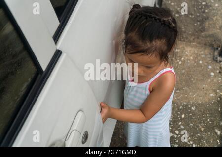 kid hand or finger pinched by the car door close up portrait of