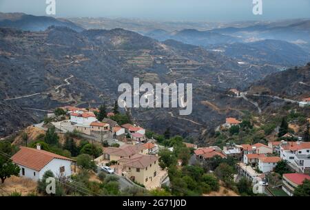 Mountain fire with burned land and disaster on agriculture. Odou Village Cyprus. Environmental disaster Stock Photo